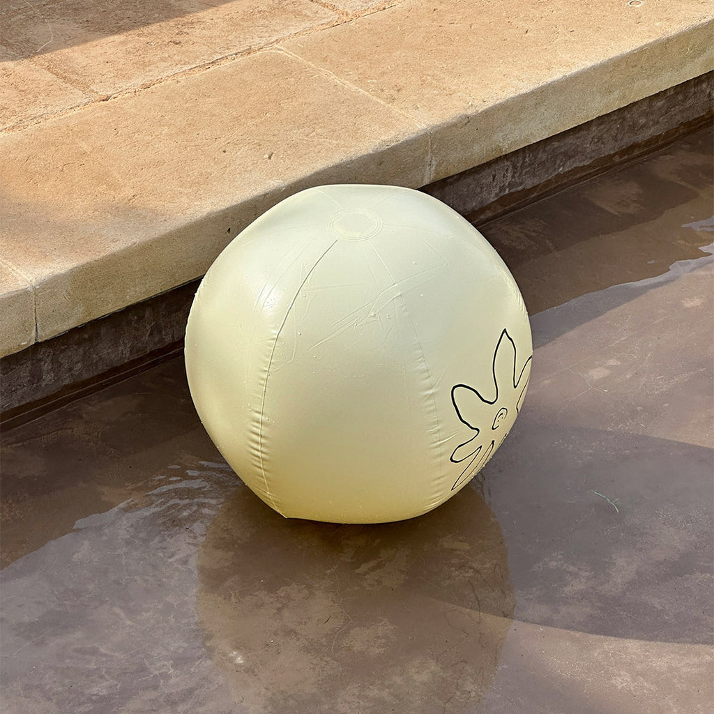 Off-white beach ball, 50 cm, featuring the black Pilgrim logo; perfect for summer fun, embodying Pilgrim's blend of timeless and trendy.