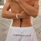 Close-up of PILGRIM Shorts XS/S showcasing the off-white cotton fabric, oversized fit, and elastic waist, designed for comfort and style in any adventure.