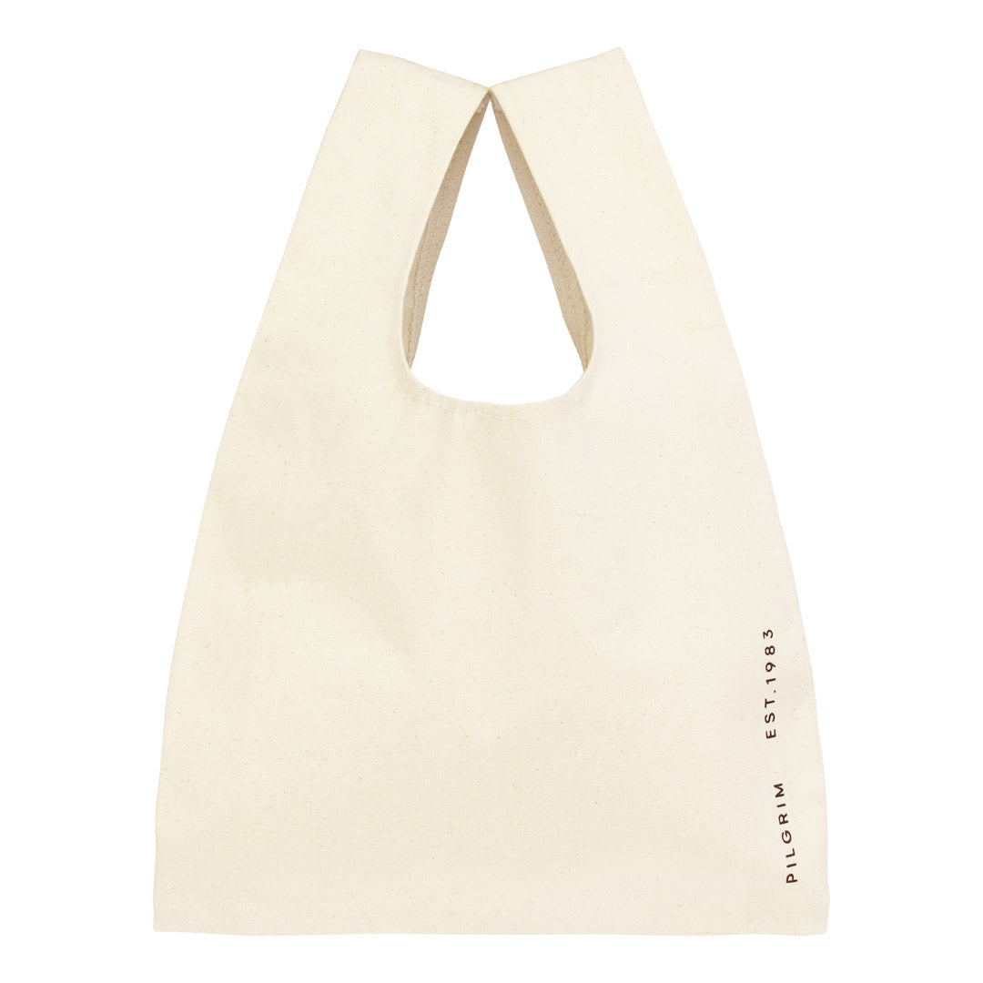 Small Fashion canvas tote-bag in off-white, featuring broad woven straps and wherever you go print, perfect for carrying essentials stylishly and sustainably.