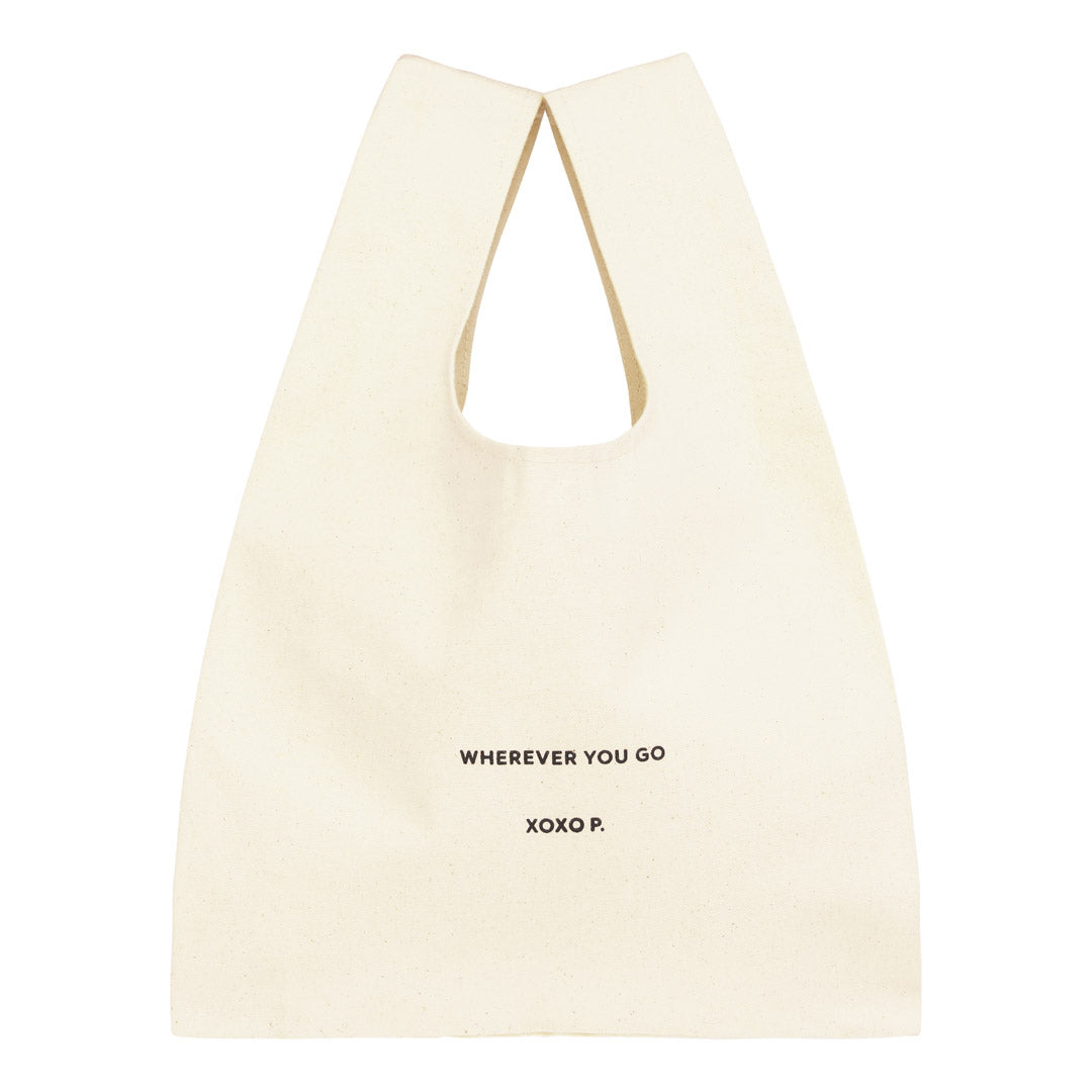 Small Fashion canvas tote-bag, off-white, with wherever you go print and broad woven straps, ideal for carrying essentials effortlessly.