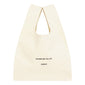 Small Fashion canvas tote-bag, off-white, with wherever you go print and broad woven straps, ideal for carrying essentials effortlessly.