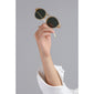 Hand holding VASILIA sunglasses with a transparent frame and dark lenses, showcasing feminine elegance and trendy style.