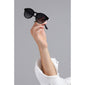 Hand holding Meriel Black sunglasses, showcasing elegant round frames with discreet metal detail near the temples, offering stylish sun protection.