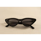 JOSELINE cat-eye sunglasses in black, featuring a sleek, narrow frame for a retro-chic look with modern UV protection, epitomizing Pilgrim's trendy, inclusive style.