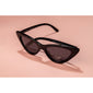 JOSELINE cat-eye sunglasses in black, featuring trendy pointed frames. Retro-inspired with modern flair, offering UVA/UVB protection and UV4-resistant lenses.