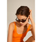 Woman wearing JOSELINE cat-eye sunglasses, showcasing trendy, retro-inspired design with pointed frames, epitomizing Pilgrim's blend of timeless and trendy fashion accessories.