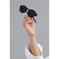 Hand holding VASILIA sunglasses with a sleek black frame and classic shape, highlighting their lightweight design and stylish appeal from Pilgrim.
