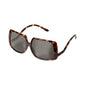 ELLEN oversized retro sunglasses with tortoise shell frames, large dark lenses, and curved temples, offering a stylish, fashion-forward look with full UVA/UVB protection.