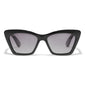 DAKOTA angular cat-eye sunglasses in black, featuring grey lenses. These elegant sunglasses from Pilgrim offer a timeless, feminine look, perfect for stylish accessorizing.