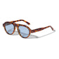 YARIL sunglasses in tortoise brown with blue lenses, featuring a playful and sustainable design from Pilgrim, offering UVA/UVB protection.