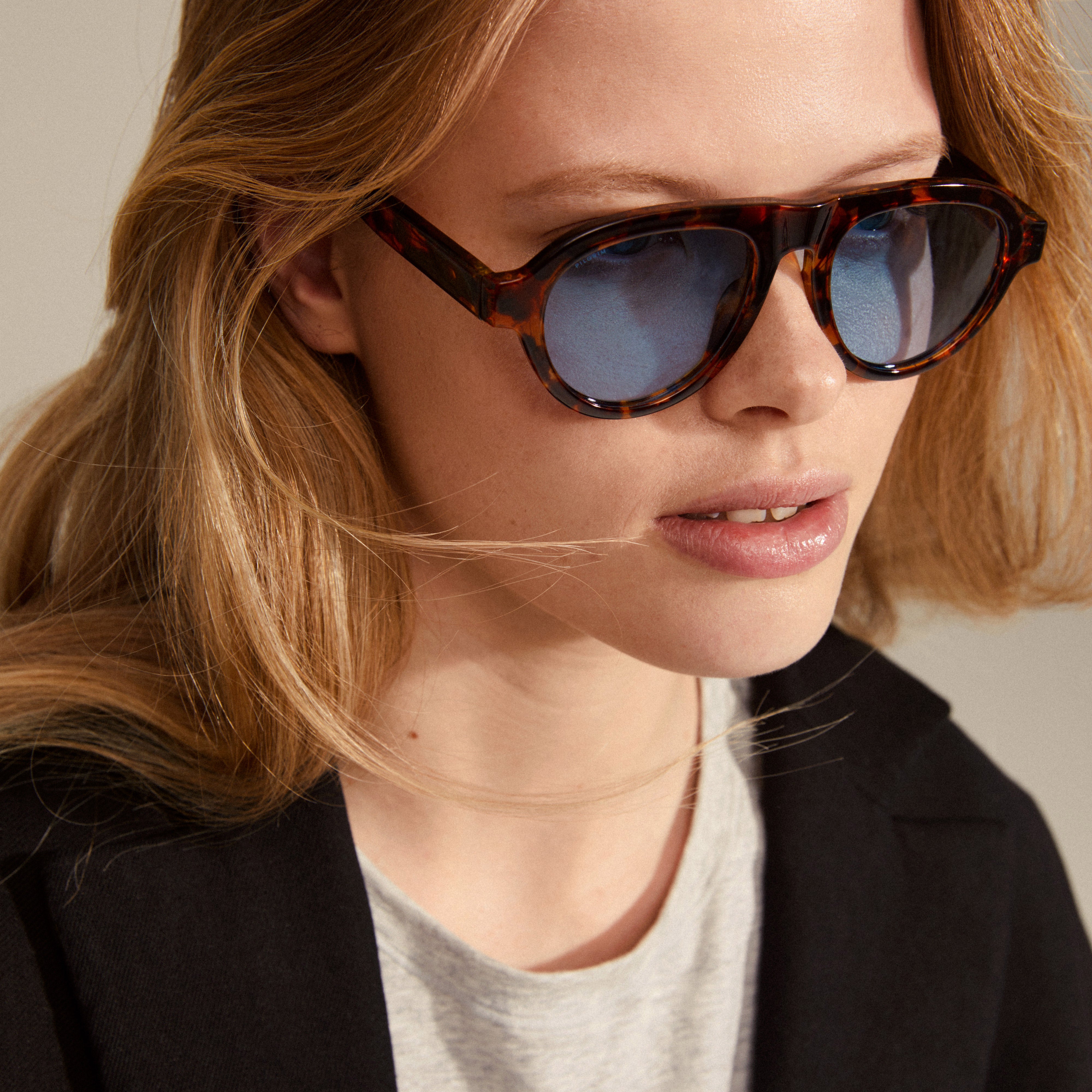 YARIL sunglasses tortoise brown, featuring a playful design with tortoise frames and light blue lenses, perfect for summer style.