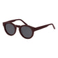 Close-up of JANICA sunglasses in dark brown from Pilgrim, featuring chunky round frames. Made from recycled acetate with UV400 protection, embodying style and sustainability.