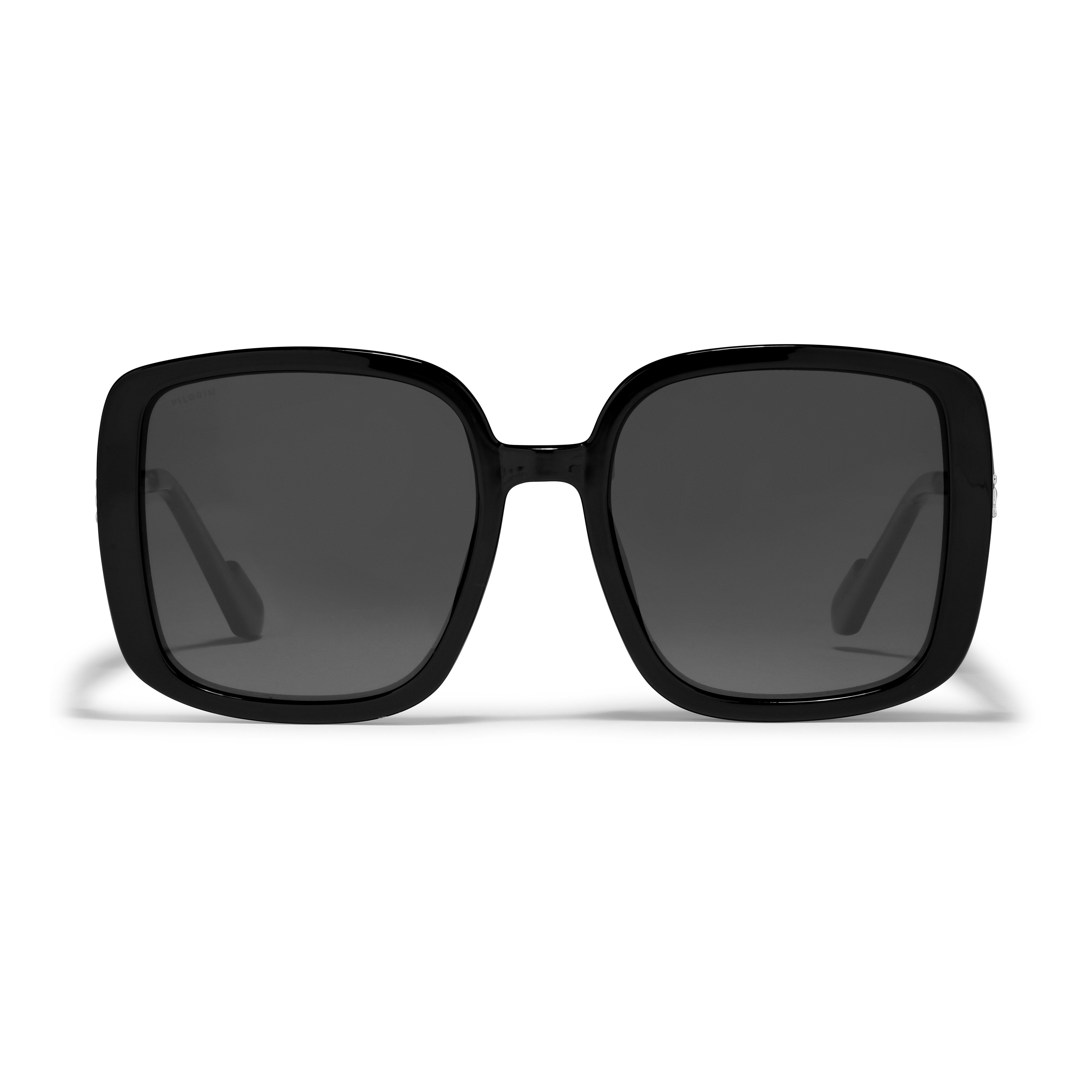 ALIET sunglasses black/gold by Pilgrim, featuring oversized black lenses, offer vintage-inspired style with UVA/UVB protection, perfect for trendy, bold looks.