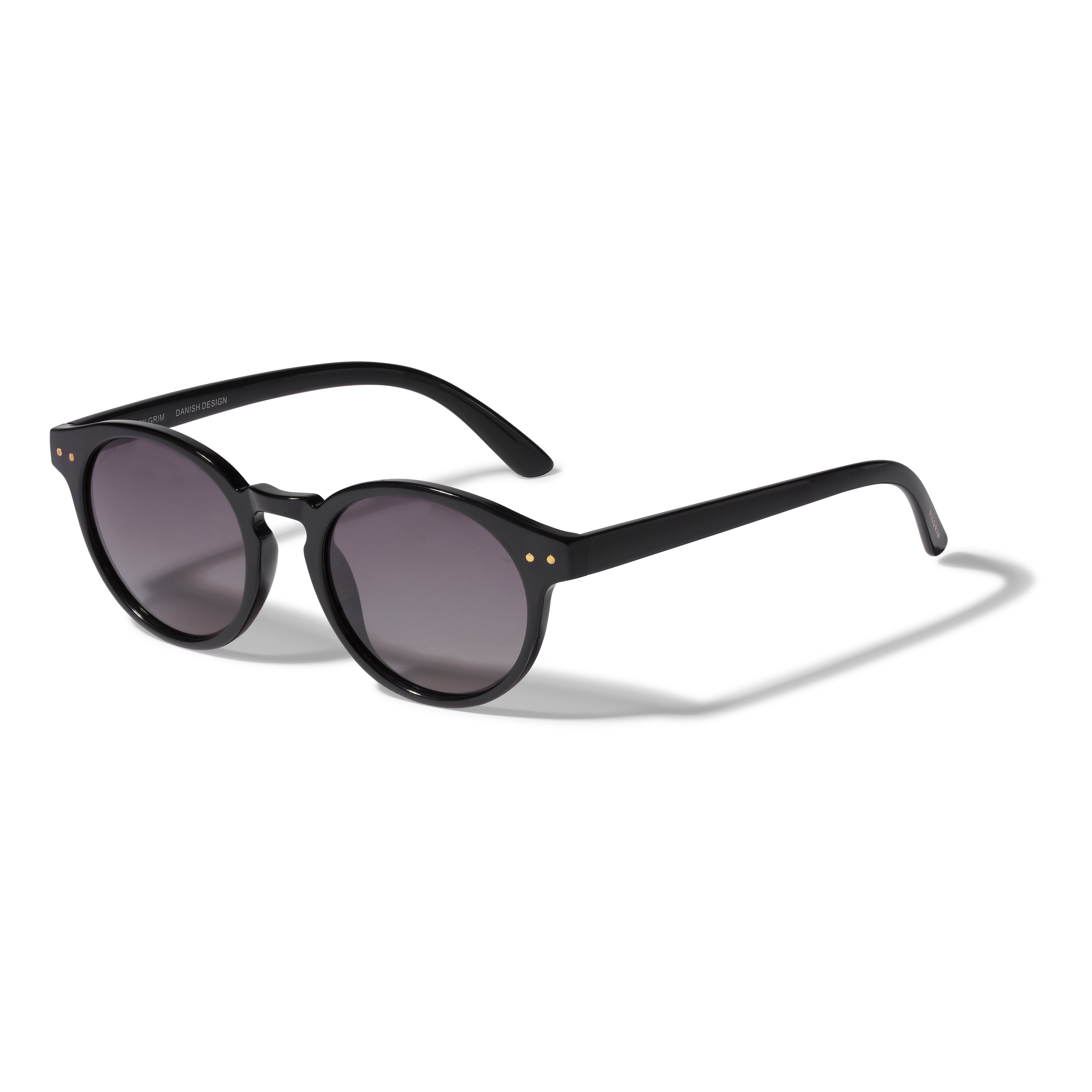 KYRIE sunglasses by Pilgrim, featuring a black frame with round lenses, offering stylish UVA/UVB protection.