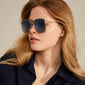 JONAN sunglasses in blue/gold, featuring oversized metal frames and ice blue lenses, perfect for summer style with UVA/UVB protection from Pilgrim.