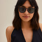 VANILLE sunglasses in tortoise brown with gold metal temples, worn by a woman, showcasing a stylish, versatile design suitable for any occasion.