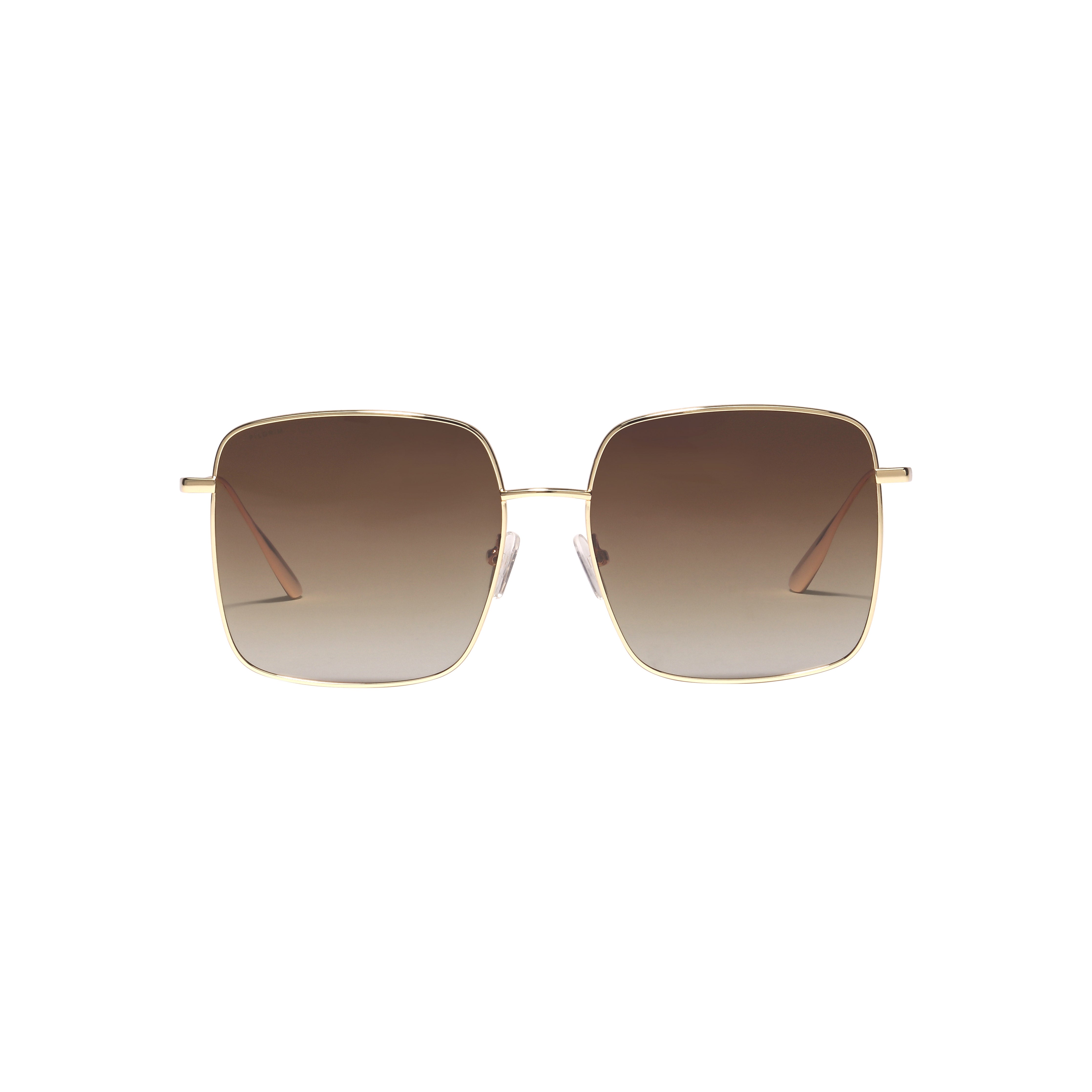 JONAN sunglasses with oversized gold frames and brown gradient lenses, featuring thin temples, embody a 70s summer vibe from Pilgrim.