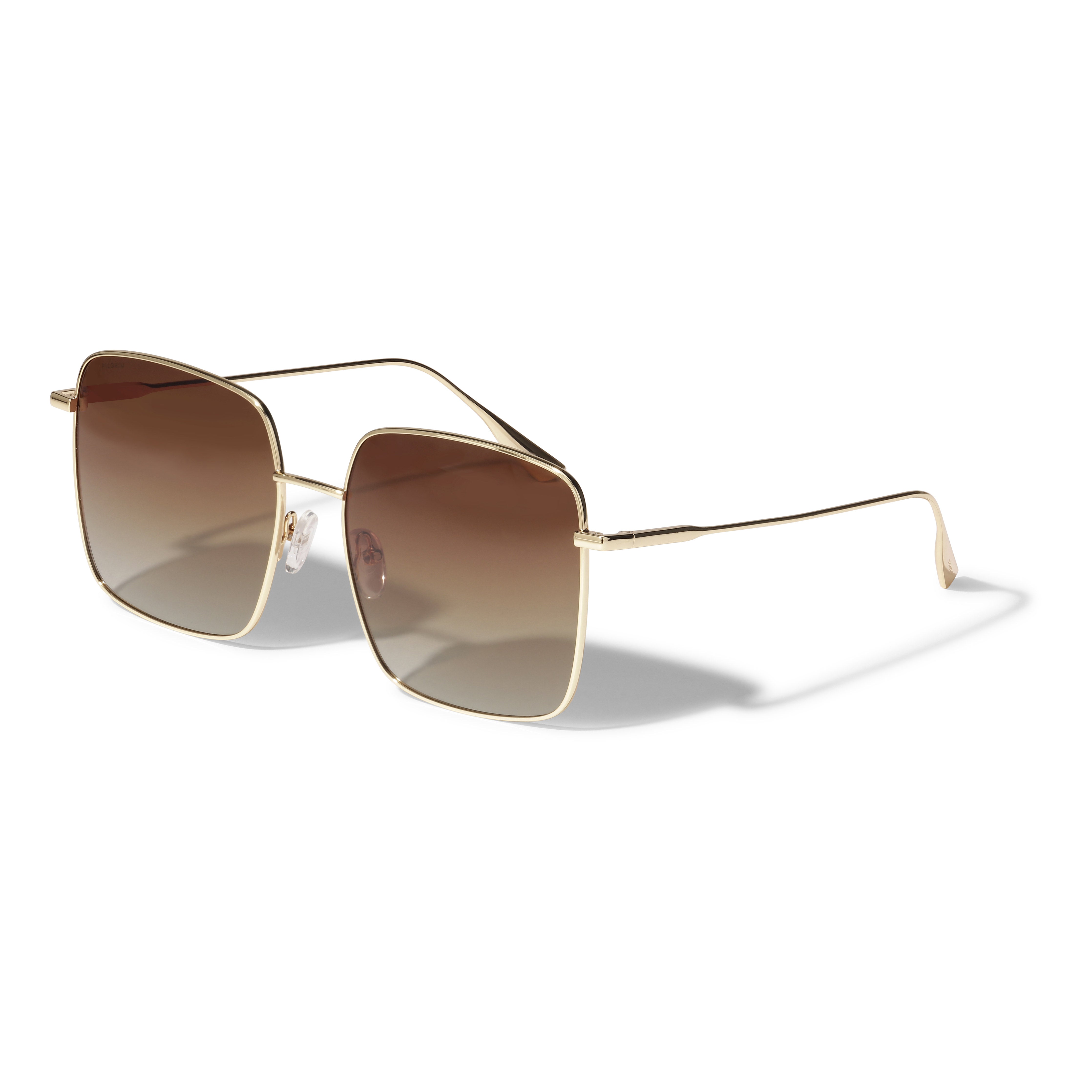 JONAN sunglasses brown/gold featuring oversized metal frames and brown lenses, embodying 70s beach vibes. Ideal for summer, with UVA/UVB protection, from Pilgrim.