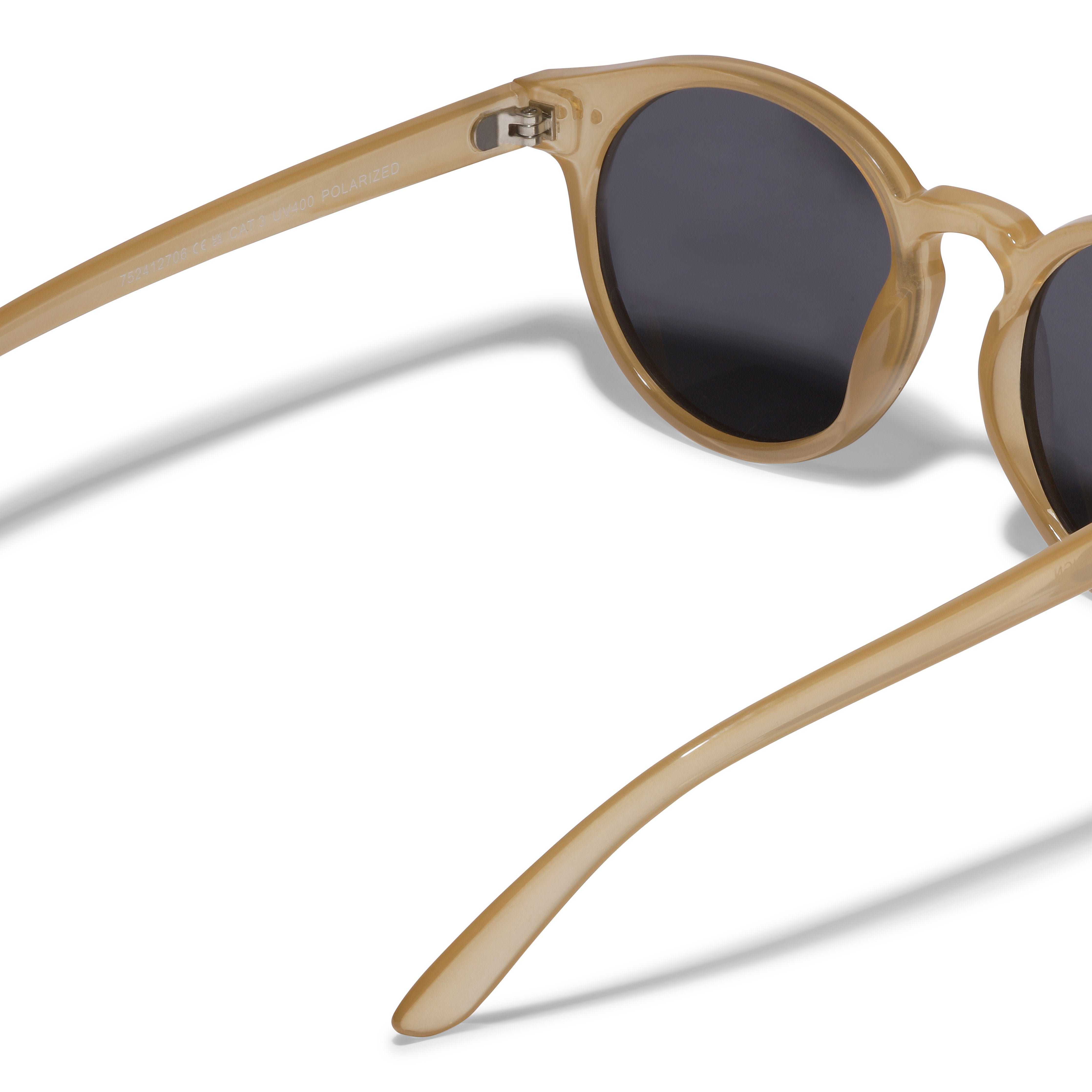 KYRIE sunglasses in light brown/gold, featuring a classic shape with smoke-colored lenses, embodying a sophisticated Nordic style. Comes with a sustainable pouch.