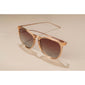 VANILLE sunglasses light brown/gold featuring slender metal temples and soft round lenses, offering a stylish and timeless accessory with UV protection, perfect for summer.