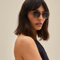 VANILLE sunglasses featuring slender metal temples and round lenses, worn by a woman. Stylish and lightweight, ideal for summer fashion.