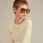 ALIET sunglasses multi/gold on a woman with short hair, showcasing oversized retro frames and golden temples, embodying a glamorous, vintage-inspired look.