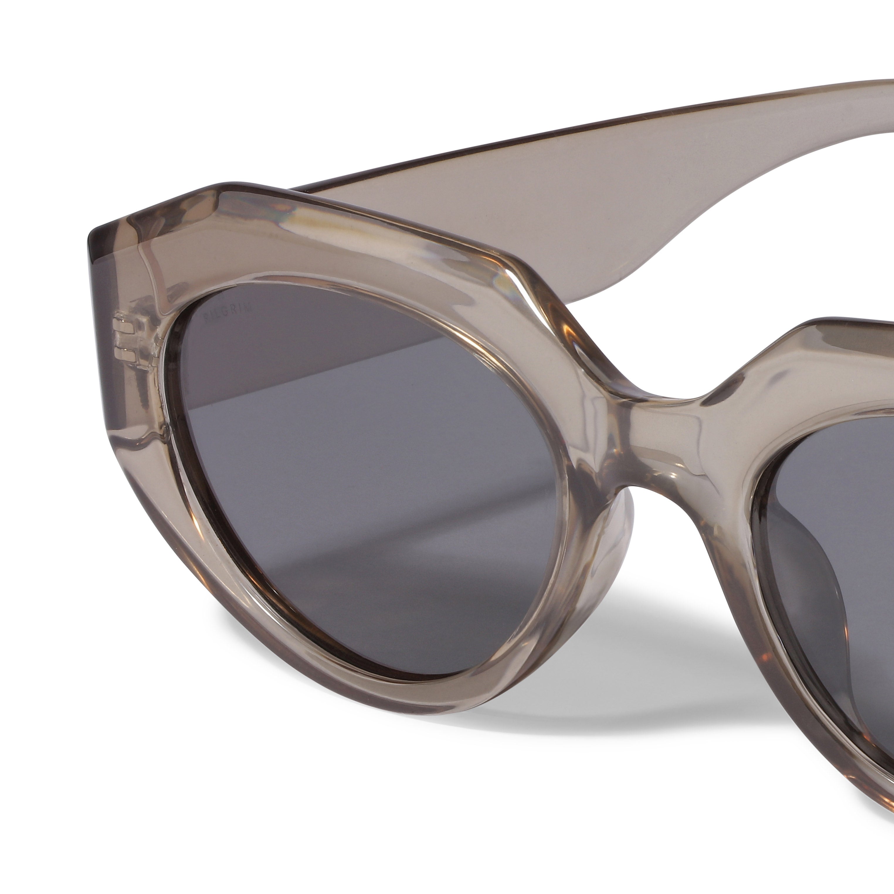 ALEXIS sunglasses light grey from Pilgrim featuring a chunky transparent frame in smoky grey with UVA/UVB protection, ideal for trendy, fashion-forward individuals.