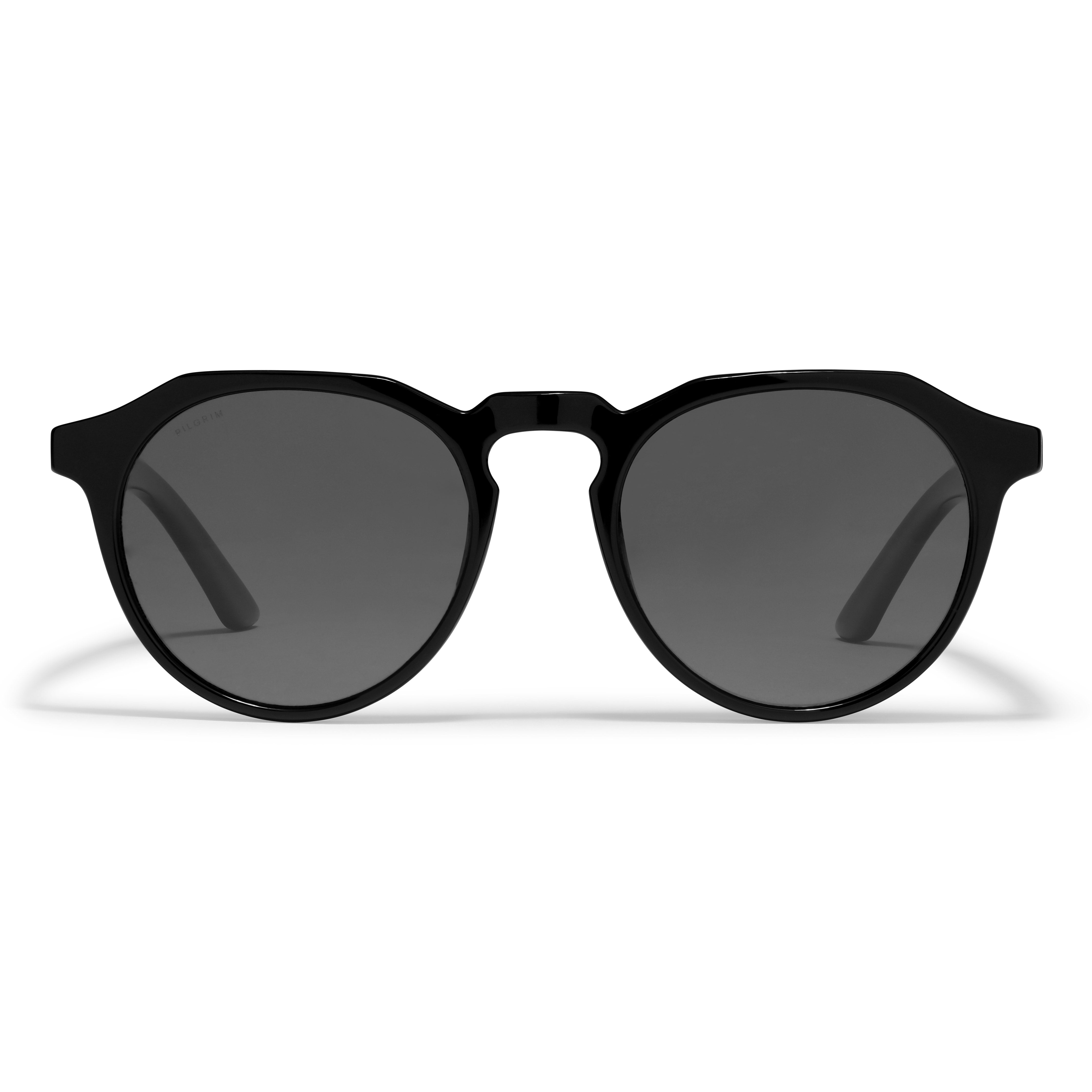 ALEJANDRA sunglasses by Pilgrim feature a modern angular frame with black lenses, offering a stylish twist on classic round designs, complete with UVA/UVB protection.