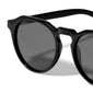 ALEJANDRA sunglasses black featuring a unique angular twist on classic round frames, offering UV protection, embodying Pilgrim's trendy, Scandinavian style.