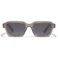 ANNALISE sunglasses in light grey feature an angular, transparent smoky frame with grey lenses, ideal for stylish sun protection and eco-conscious fashion.