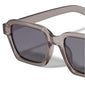 ANNALISE sunglasses in light grey, featuring an angular frame with smoky lenses, offering stylish UVA/UVB protection, ideal for versatile wear.