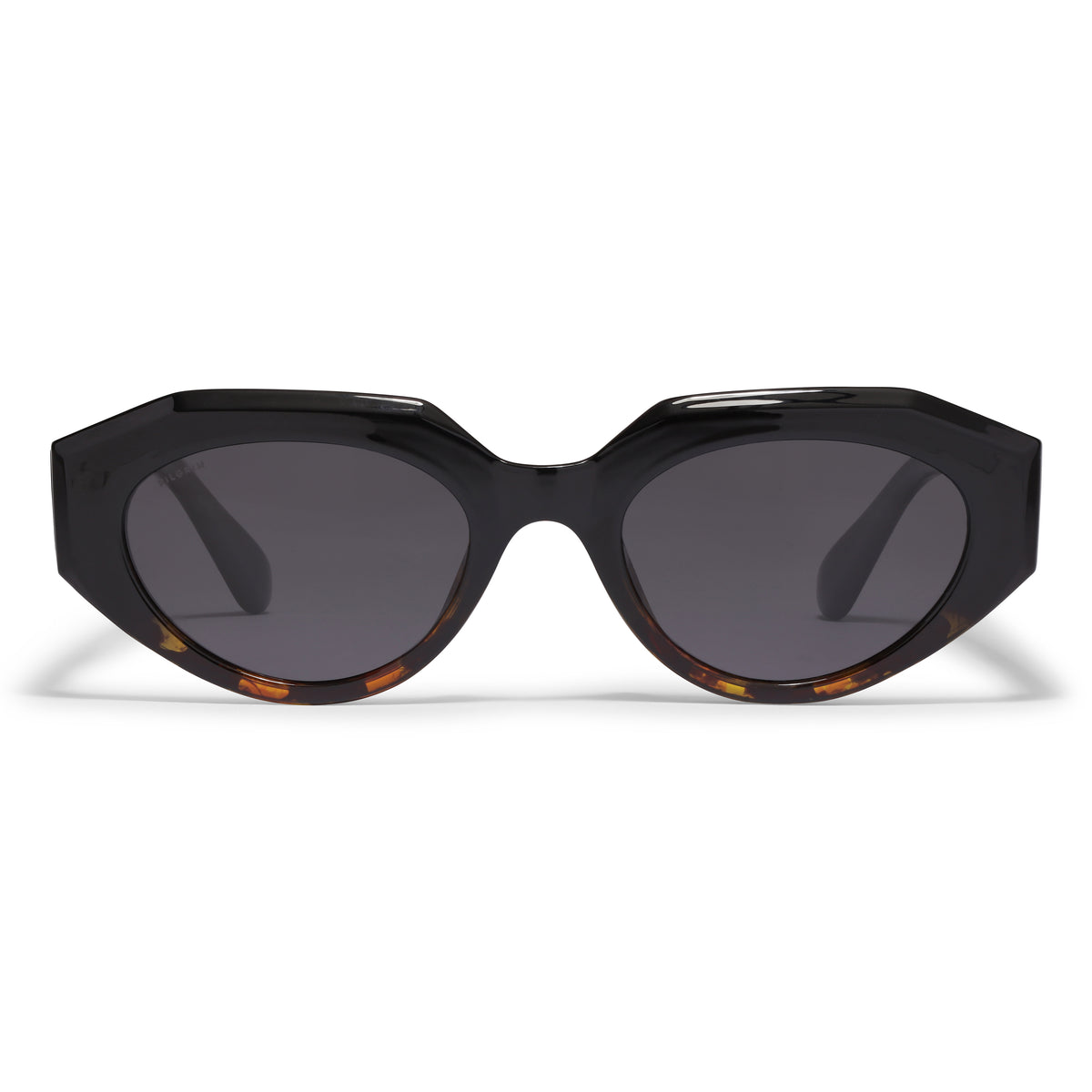 Close-up of ALEXIS sunglasses in tortoise brown featuring a chunky, futuristic design by Pilgrim, made from 75% recycled plastic with UV400 protection.