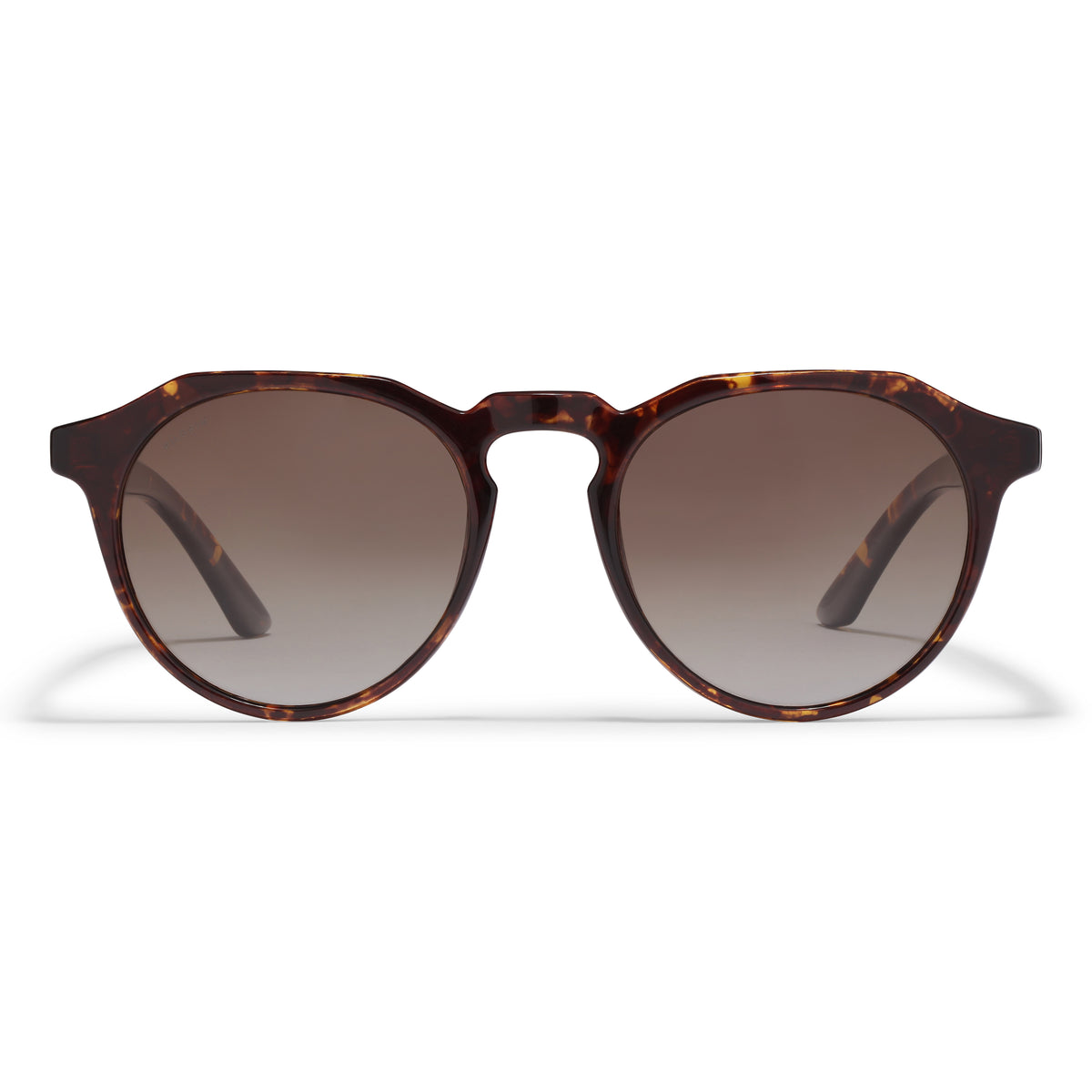 ALEJANDRA sunglasses in tortoise brown, featuring a unique angular and round frame design, offering UVA/UVB protection. Ideal for a trendy spring look from Pilgrim.