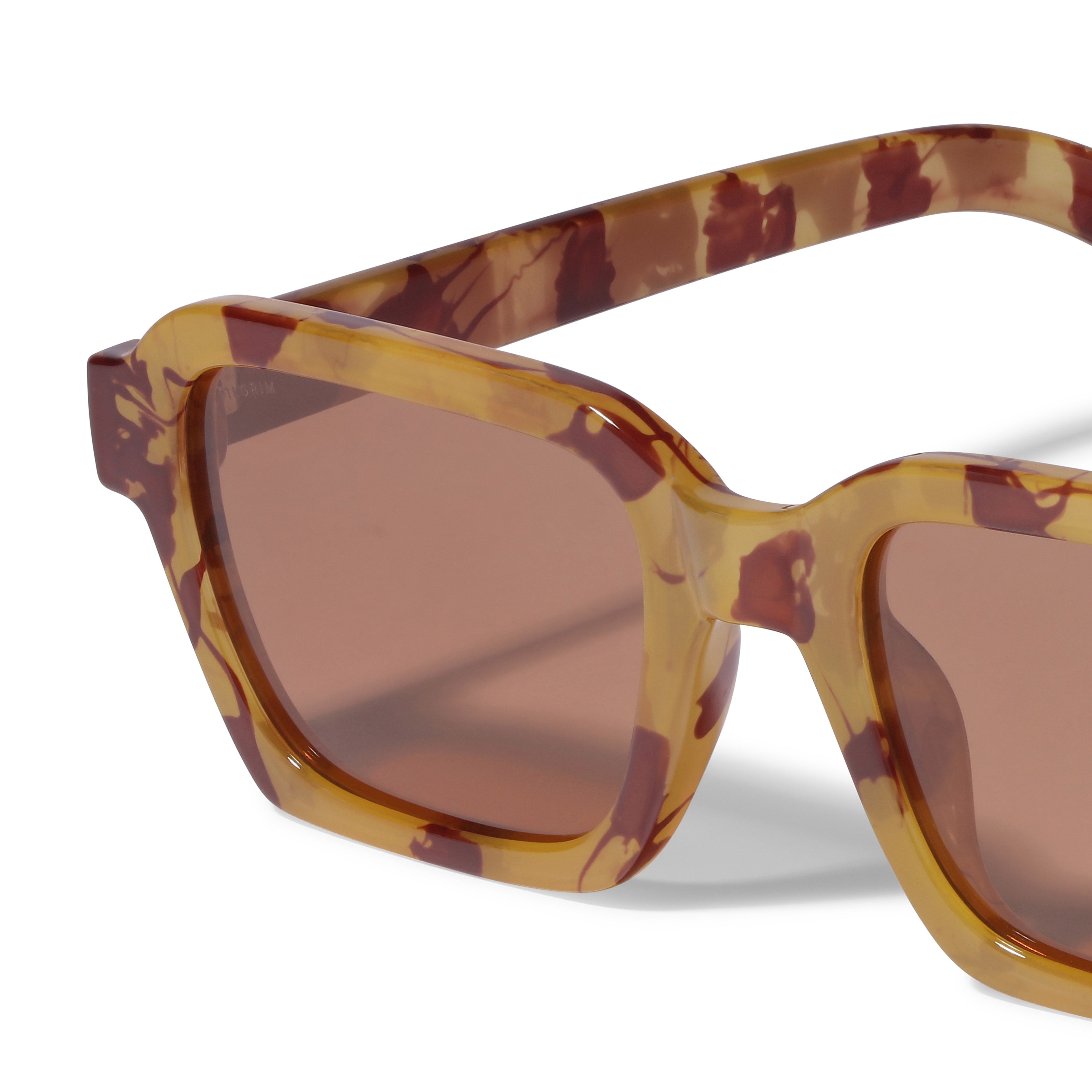 ANNALISE tortoise brown sunglasses with angular frames and brown lenses, ideal for sunny days, offering style and UVA/UVB protection. Comes with a protective fabric pouch.