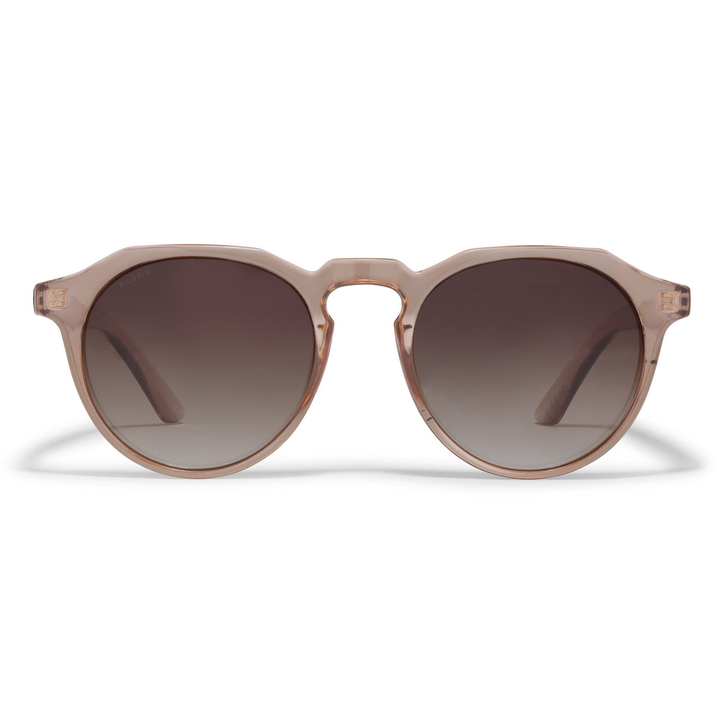 ALEJANDRA sunglasses light brown feature a unique round-to-angular frame design, offering a stylish twist. Includes a fabric pouch that serves as a protective case and cleaning cloth.