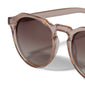 ALEJANDRA sunglasses in light brown with a unique angular twist on a classic round design, offering style and attitude. Comes with a dual-purpose fabric pouch.