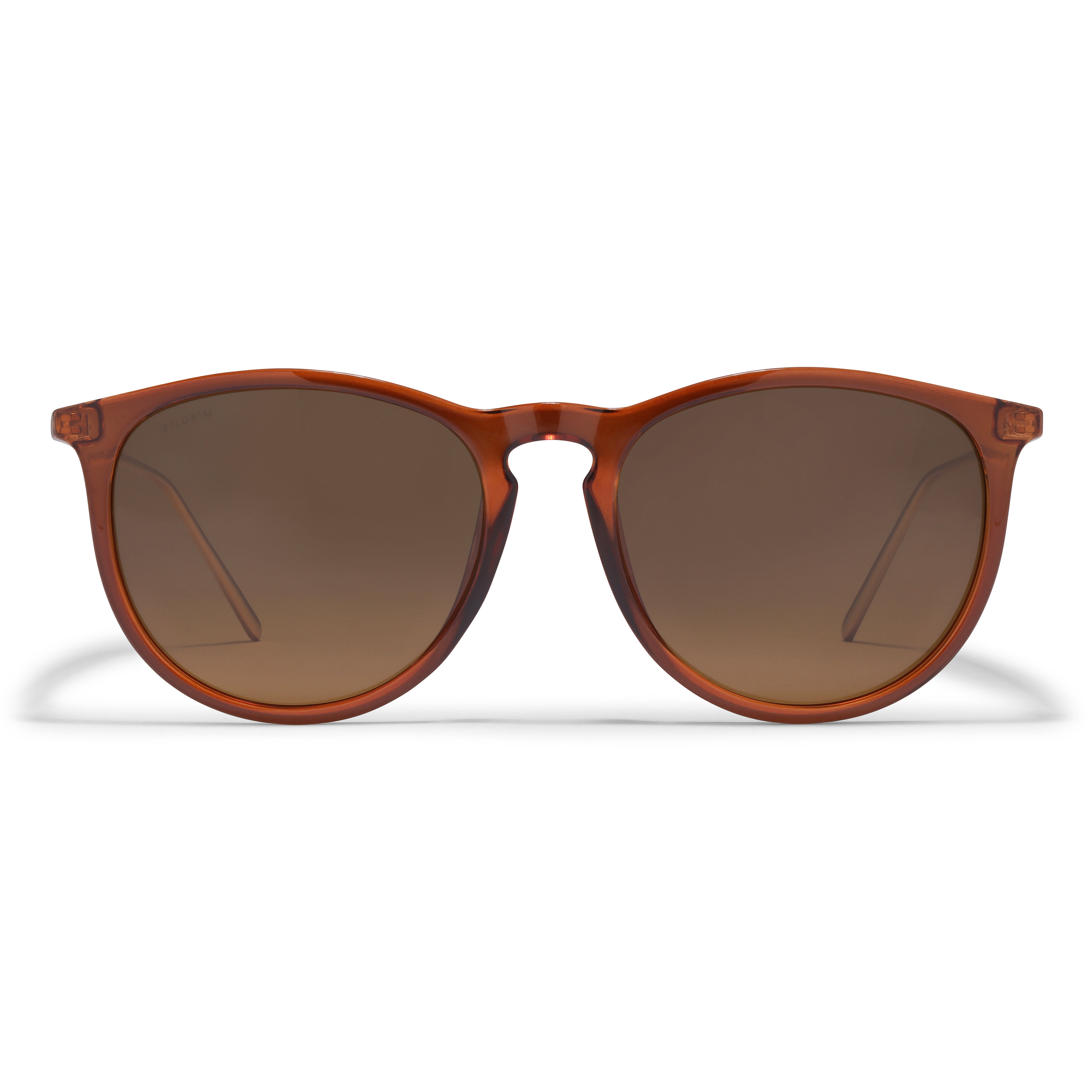 VANILLE sunglasses in brown with gold-plated temples, featuring a sleek, transparent frame. Ideal for minimalist styles, offering UVA/UVB protection from Pilgrim.