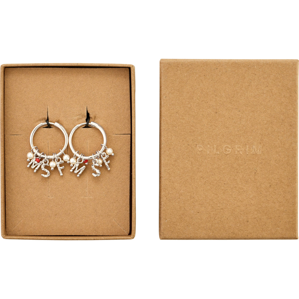 MSF earrings silver-plated in a kraft-paper box, featuring charms of pearl-style beads, red bead, and letter pendants, supporting Doctors Without Borders with recycled materials.
