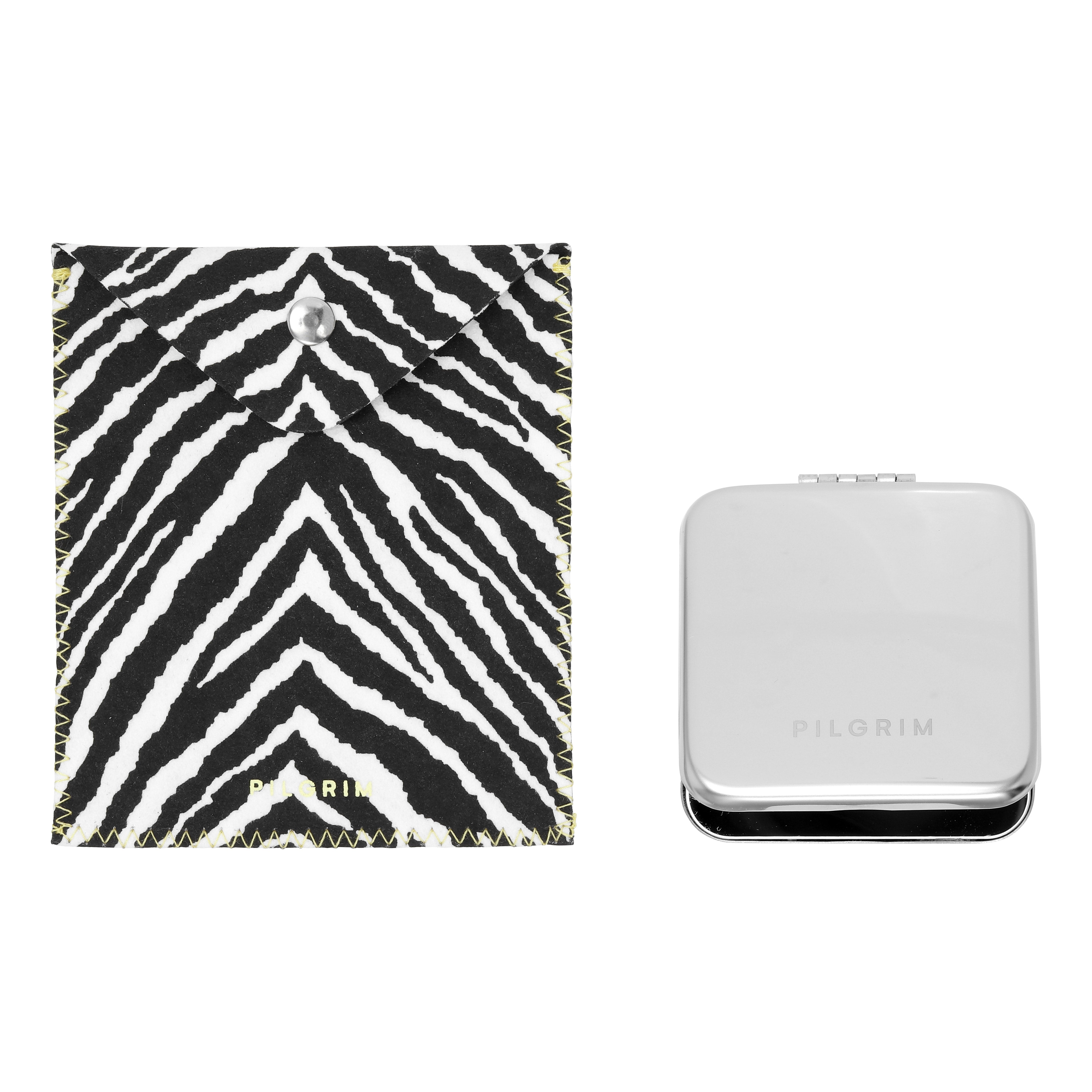 Pilgrim Mirror w. Zebra pouch: A compact silver tin mirror with embossed branding, paired with a bold zebra-print felt pouch, ideal for stylish on-the-go touch-ups.
