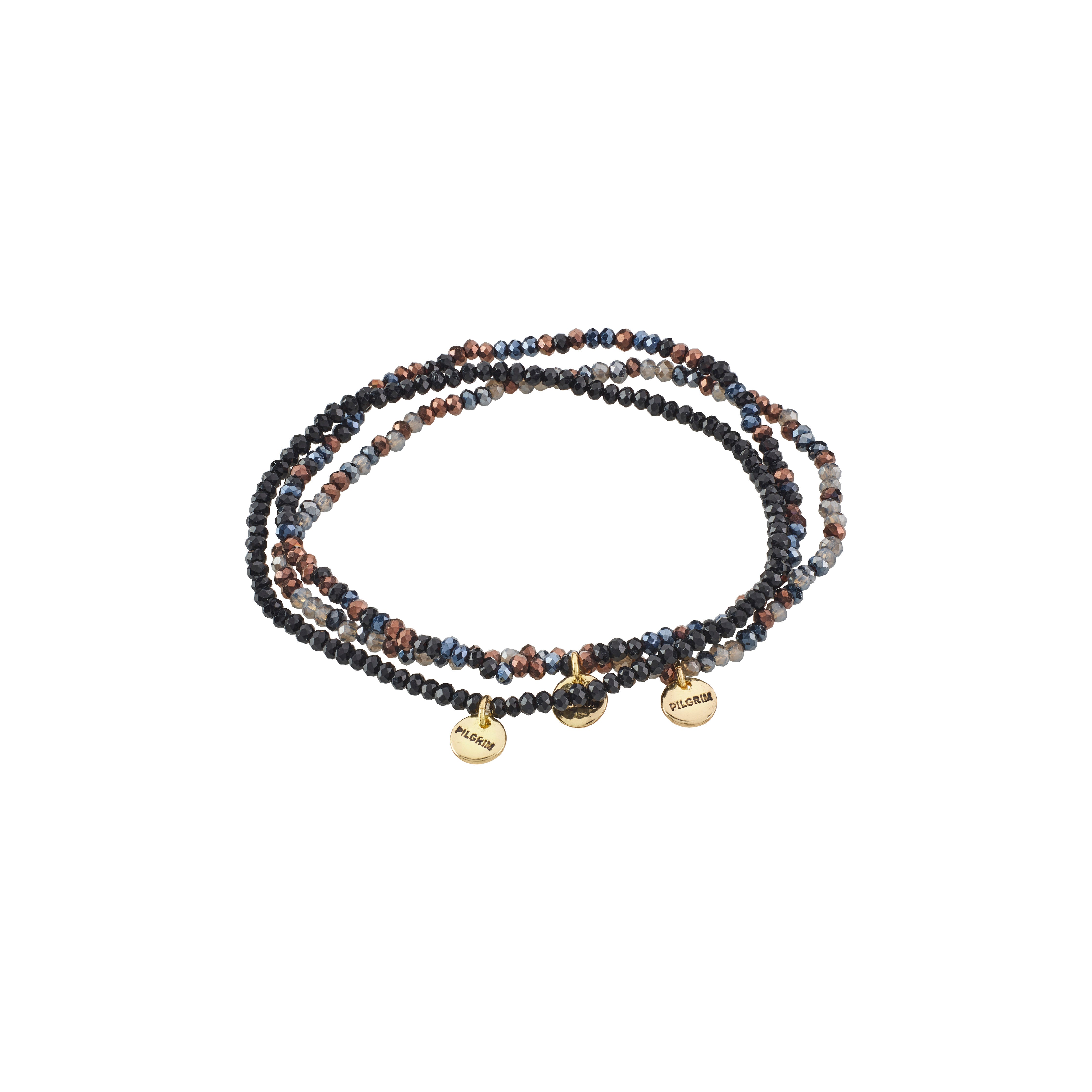 INDIGO 3-in-1 bracelet set featuring fine grey-black beaded bracelets with gold-plated charms, designed for versatile styling on durable elastic cords.