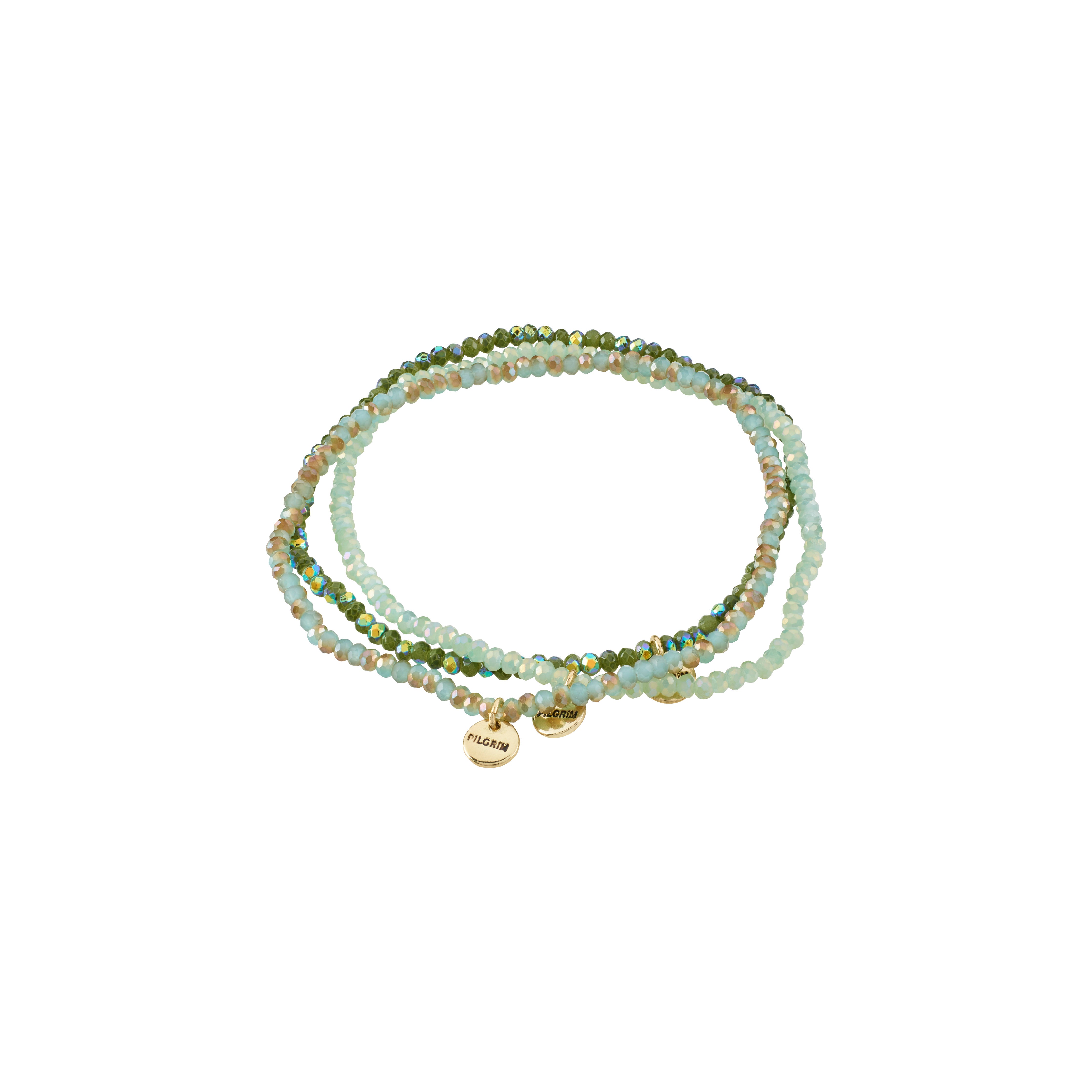 INDIGO 3-in-1 bracelet set, green/gold-plated, features soft green and neutral glass beads with gold-tone spacers and Pilgrim logo tags, offering versatile style options.