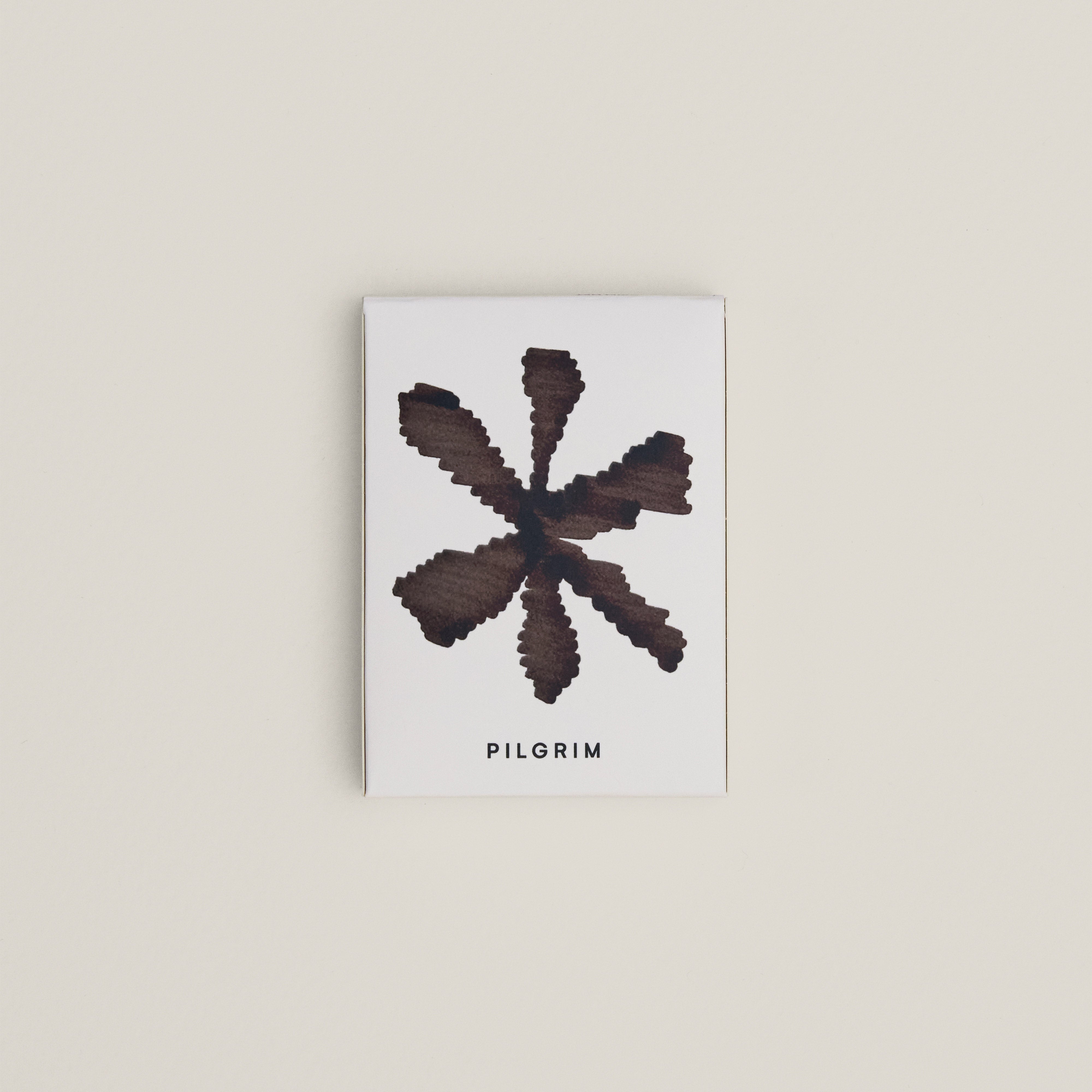 Limited Goodie Bag: A white box with a black star graphic, featuring gold-plated hoops and a foldable mirror, nestled in a soft cotton pouch.