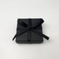 Luxurious gift box with black ribbon, perfect for Pilgrim's eco-friendly jewelry packaging, enhancing elegance with sustainable materials. Ideal for rings, earrings, and small necklaces.